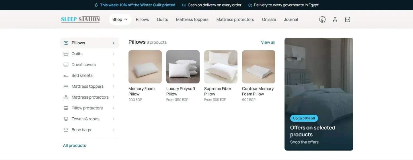 The Shop mega menu with pillows and an offers panel