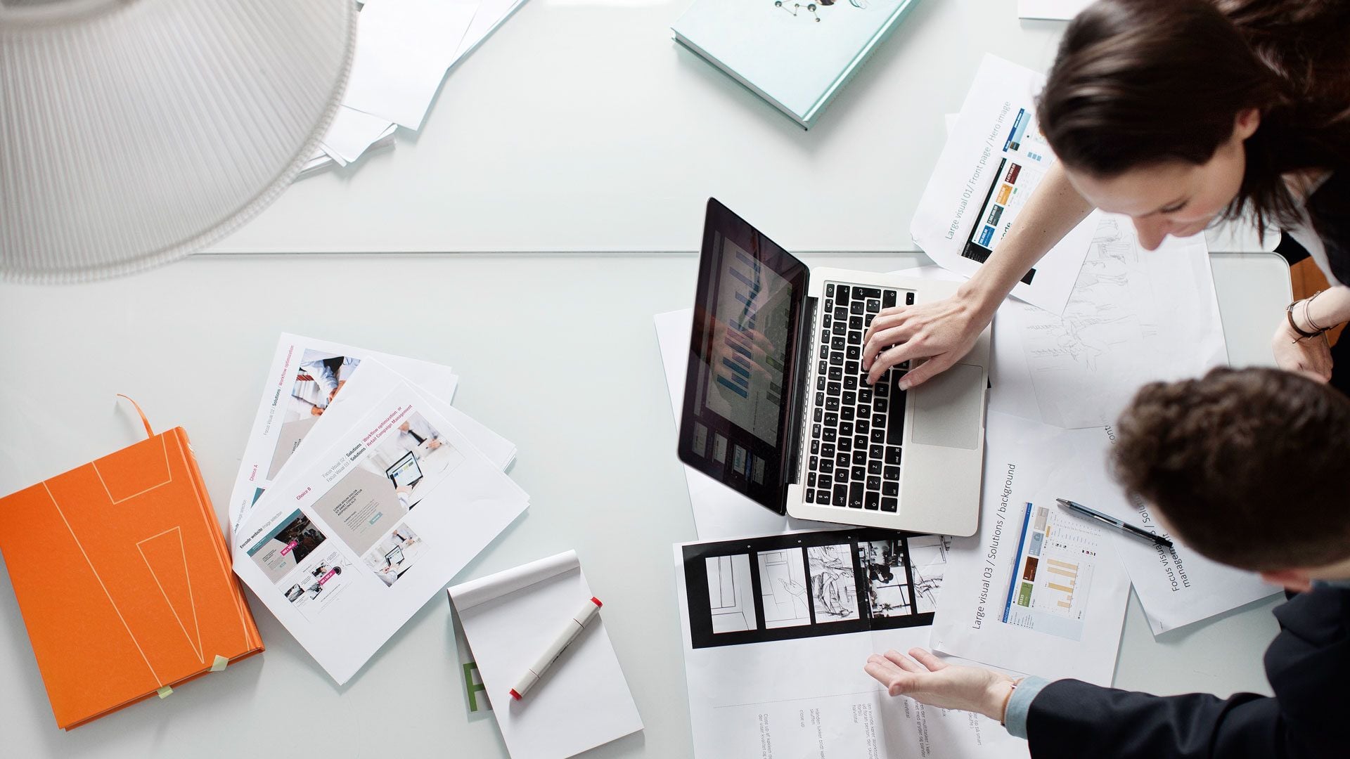 Cross-functional team reviewing growth metrics and test results on a shared screen