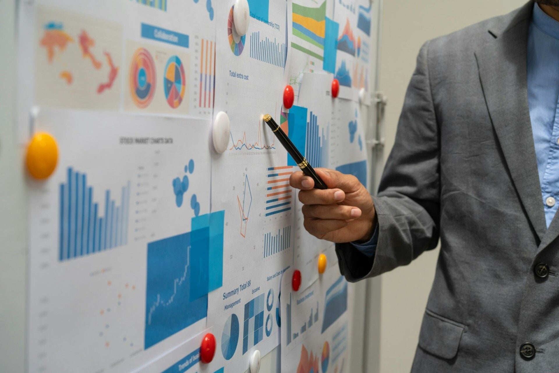 Marketing team reviewing emerging technology ideas on a wall screen in a modern office