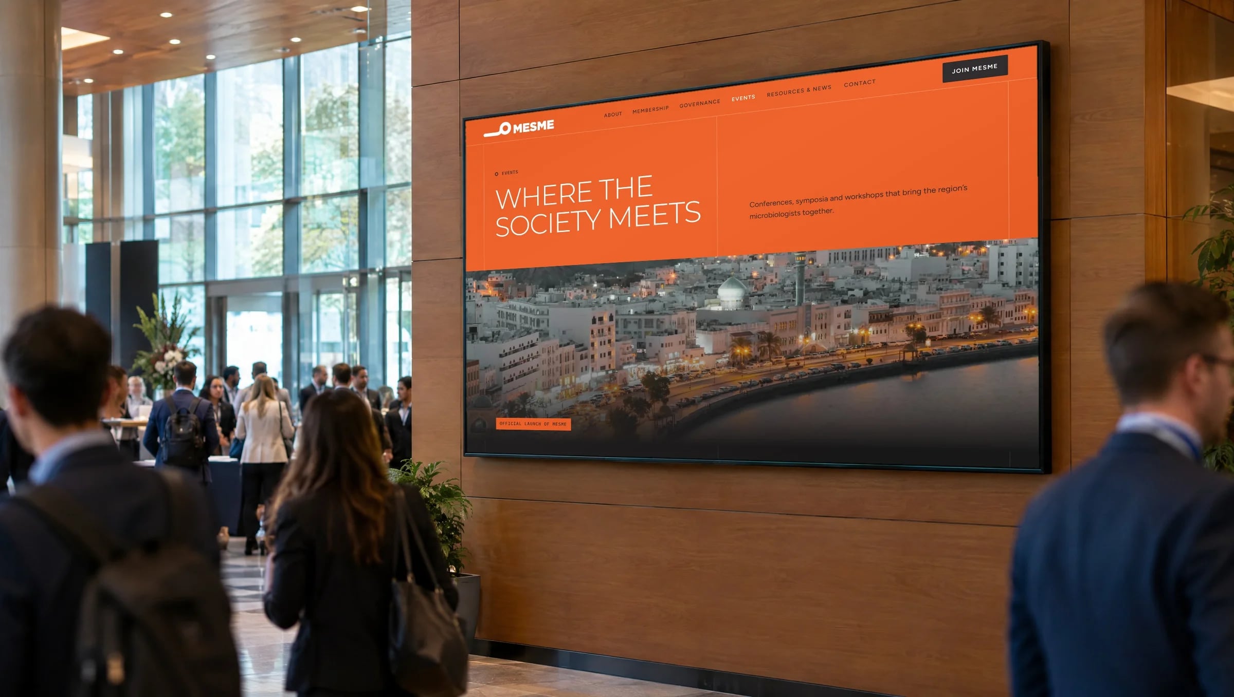 The MEsME events page on a large screen in a conference foyer